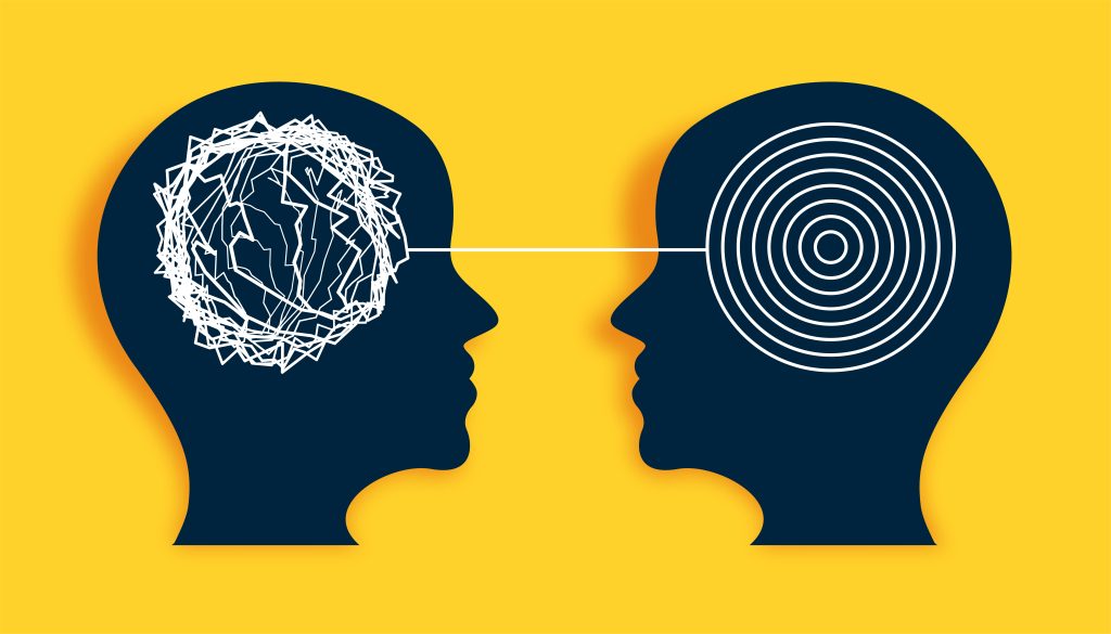 Deux têtes en silhouette : un cerveau en pensées enchevêtrées face à un cerveau ordonné, pour distinguer la dyslexie et le TDAH.